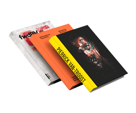 Three hardcover yearbooks with colorful covers floating