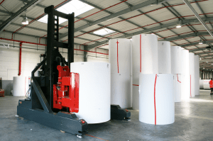 Large rolls of paper use for web-fed offset printing.