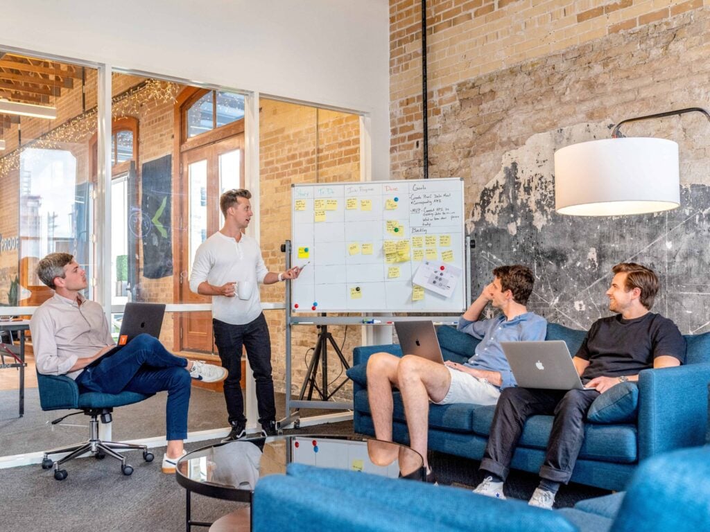 Four entrepreneurs making business goals and pre planning for a trade show or business event