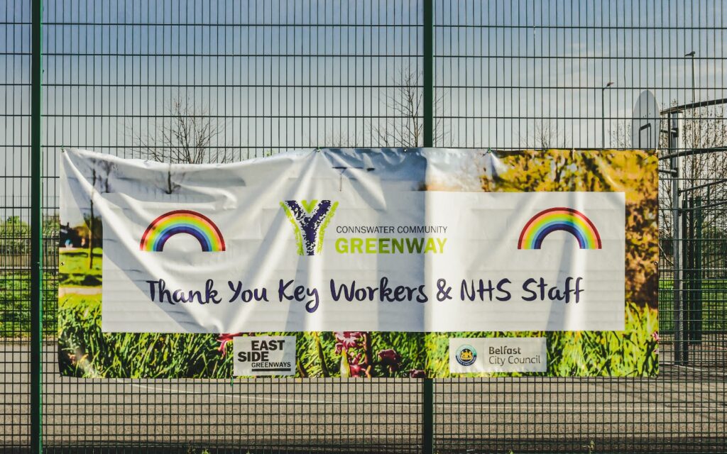 Banner hanging on a fence thanking key workers and staff