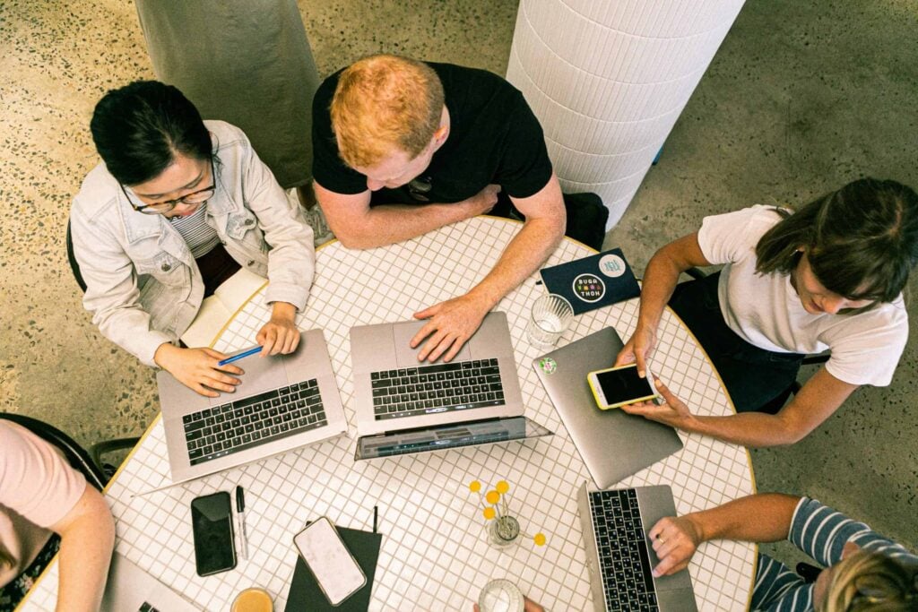 photo of people using laptop
