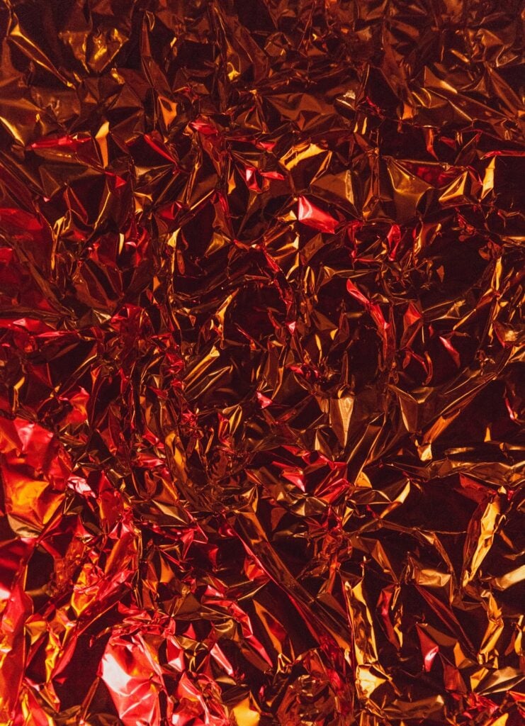 Red metallic foil crinkled