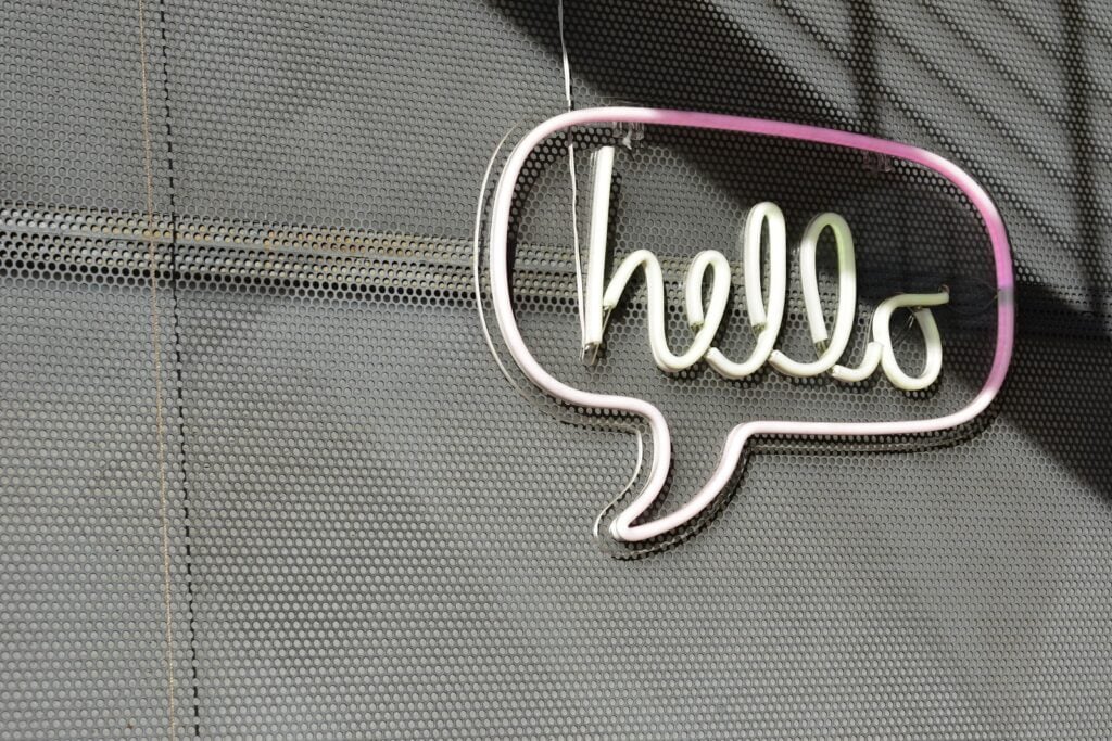 Neon sign of hello in a dialogue bubble 