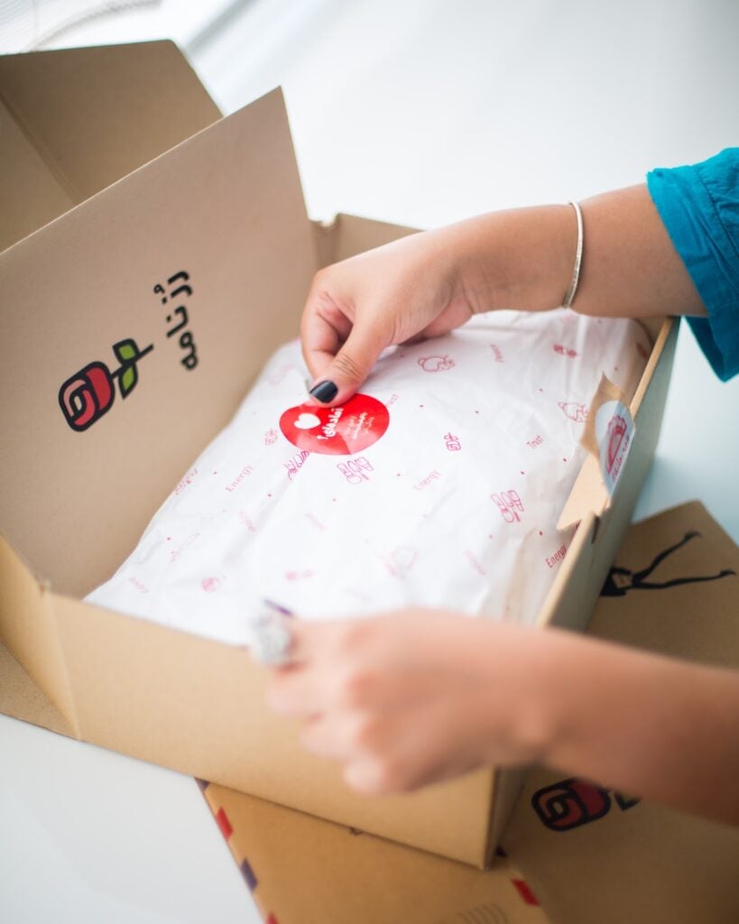 Custom Mailer Box with design being packaged