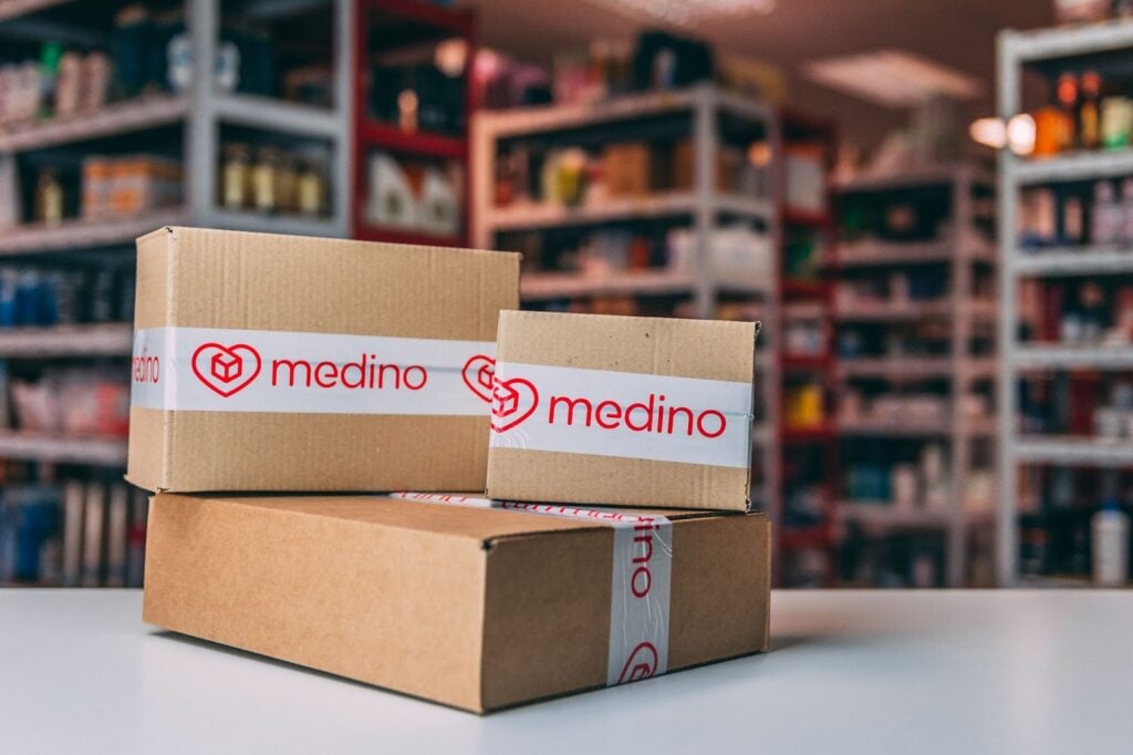 Shipping boxes with branded tape on table