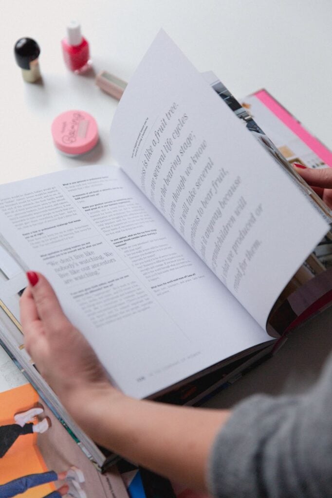 Woman  flipping through a catalog printing