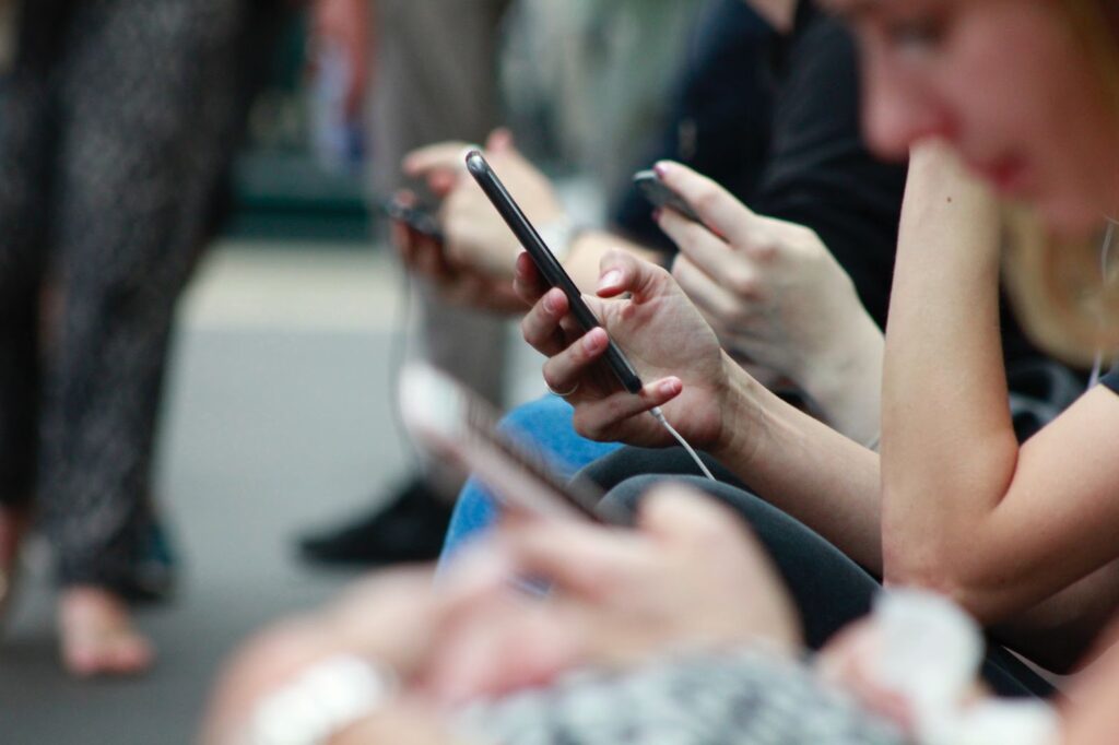 Close-up of people on their phones