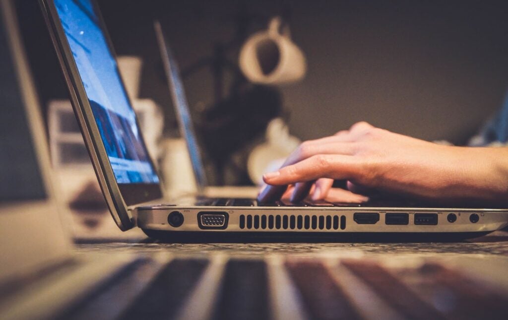 Person typing on computer