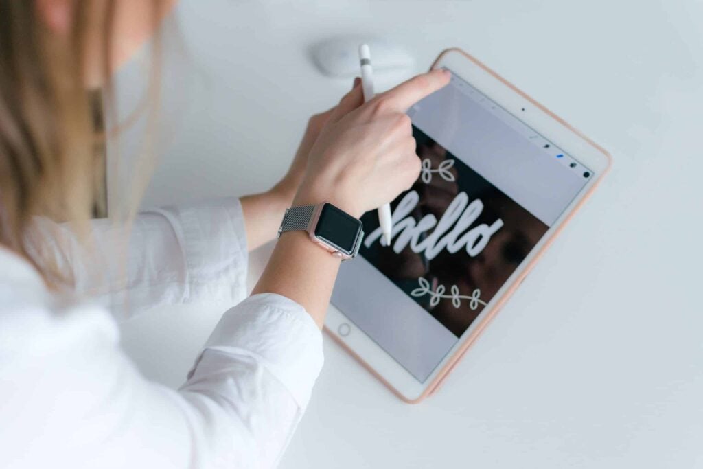 person drawing on their iPad