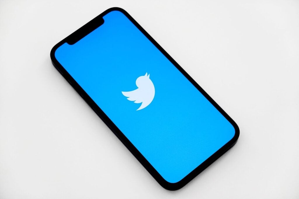 phone with the twitter app loading
