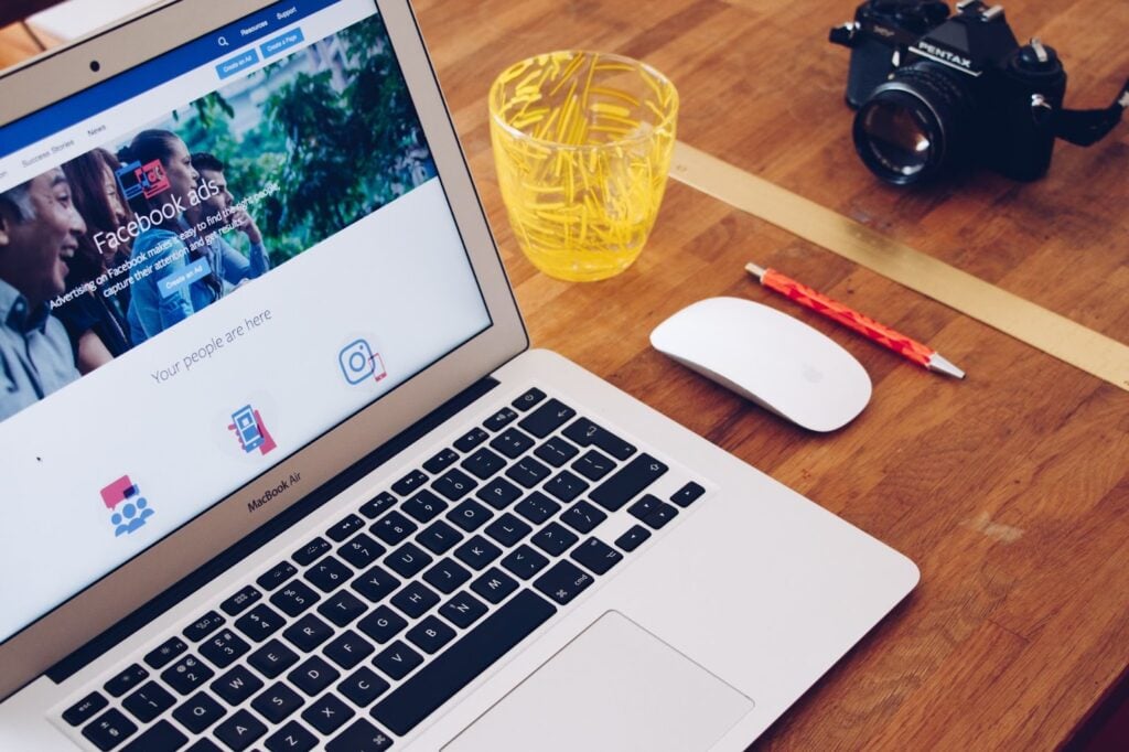 Laptop on table with Facebook ads open