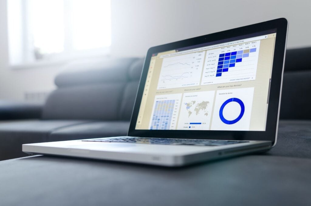 Laptop open with graphs and tracking