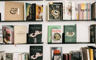 Hardcover books on a shelf with their front cover facing out