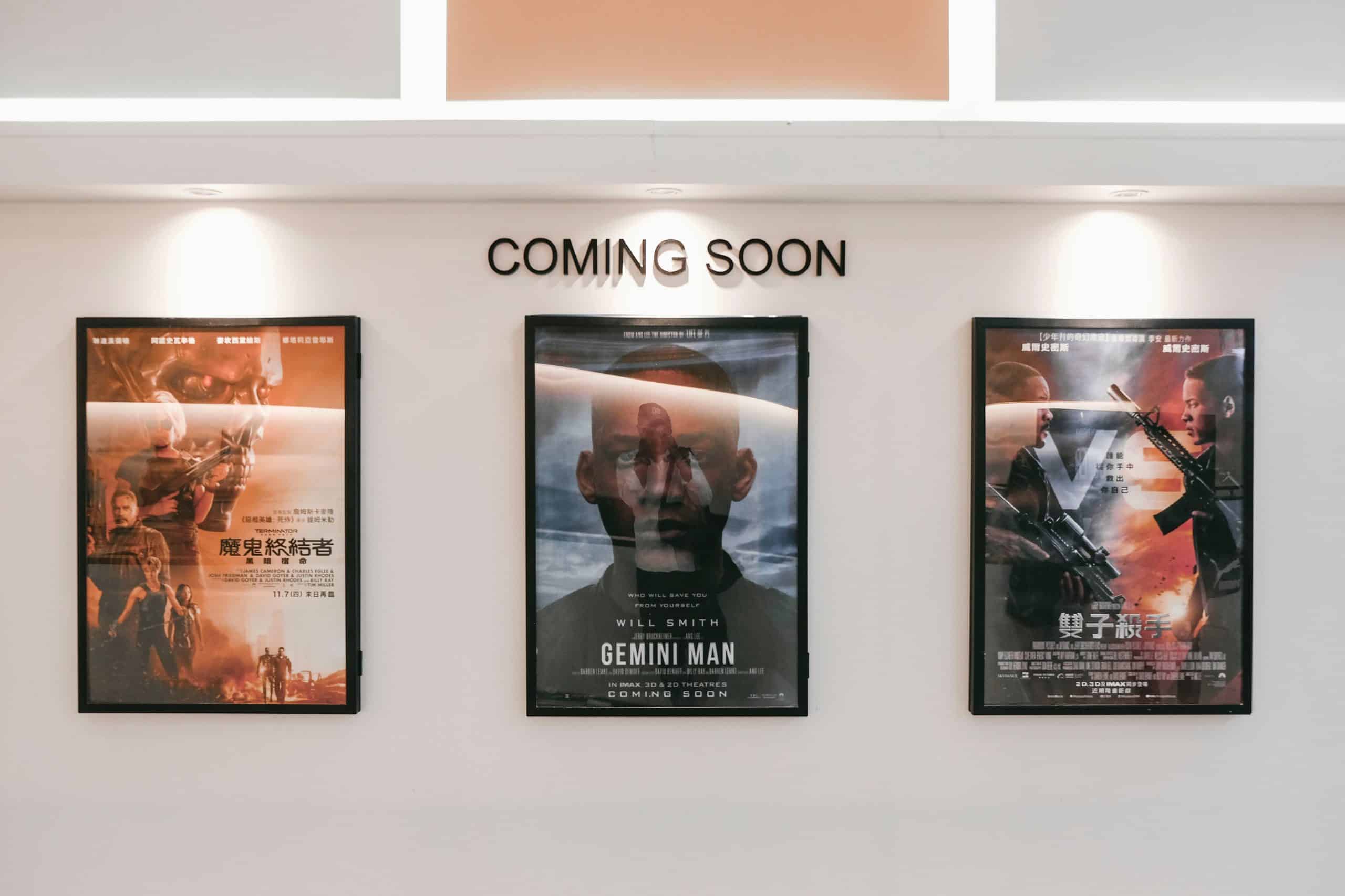 Three movie posters hanging on a wall